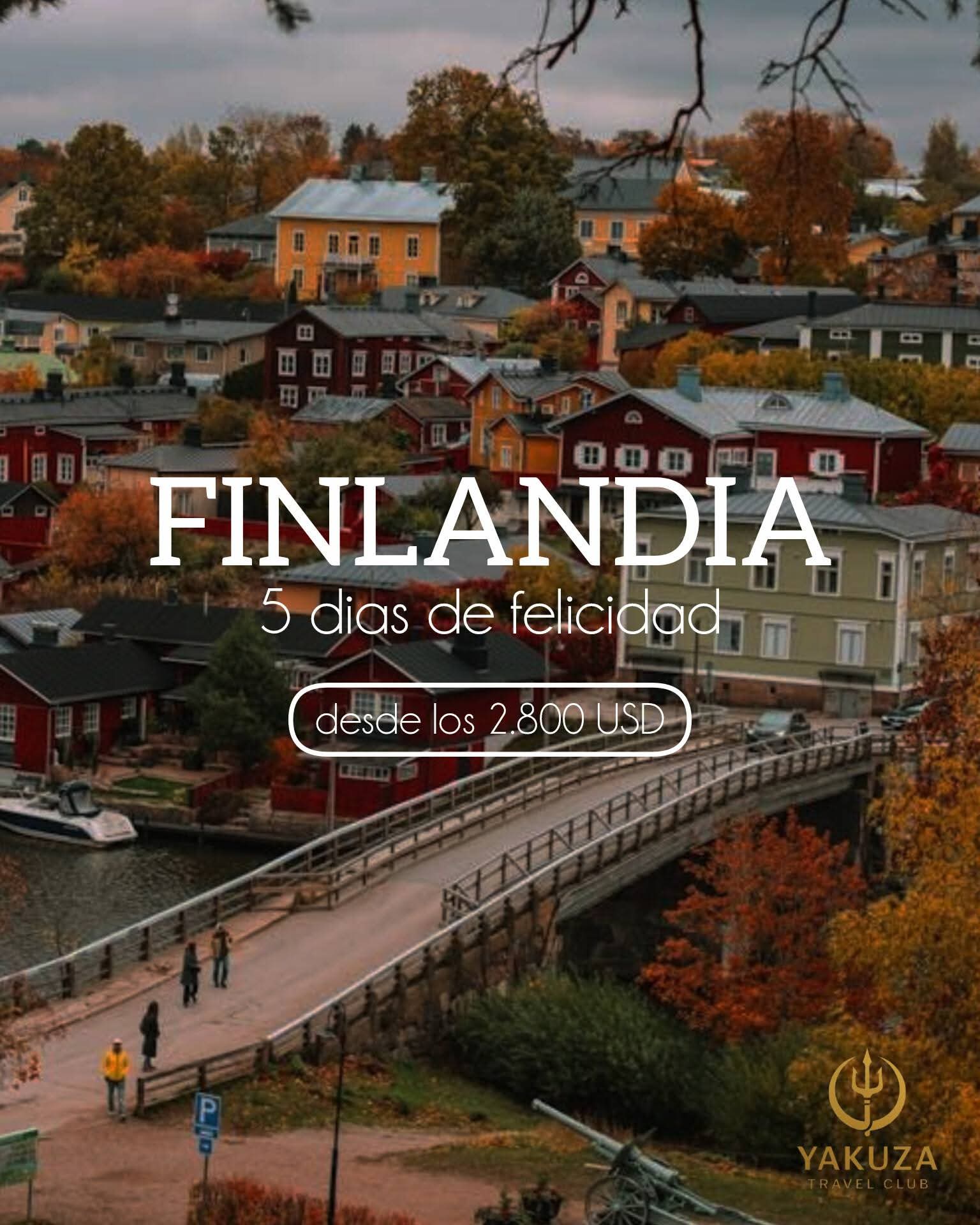 Colorful autumn Finnish town with houses, a river, and a bridge, featuring 'FINLANDIA' text.